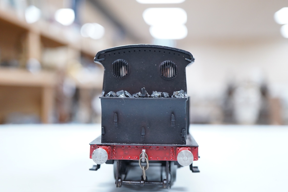 An 0 gauge scratch built model railway locomotive by John Worsley, a Southern Railway P class 0-6-0T, 1325, a detailed model with opening smoke box door showing the details of the blast pipe and boiler tube ends, sprung